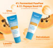 Two Dermal Therapy Lip Balm Pawpaw tubes with ingredient callouts and papaya slices in the background