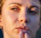 A woman with a cold sore, touching her lips thinking about using Dermal Therapy Cold Sore Cream