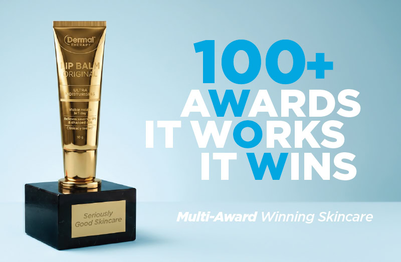 Dermal Therapy Lip Balm Original on an award trophy base with the text &ldquo;100+ Awards It Works It Wins&rdquo; and &ldquo;Multi-Award Winning Skincare&rdquo; on a light blue background.