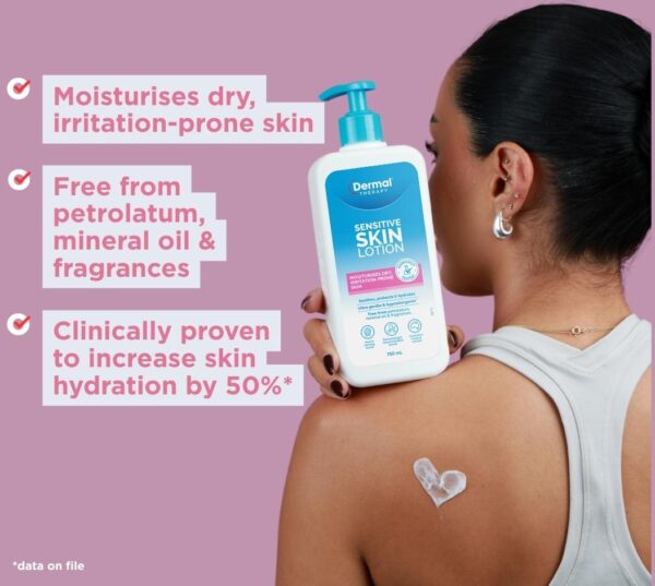 Person holding a bottle of Dermal Therapy Sensitive Skin Lotion beside visible product feature text on a pink background.